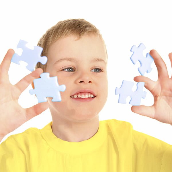 Boy with puzzle pieces